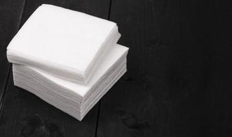 white paper napkins on wooden background Close up photo