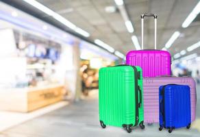 Suitcases for rest against the background of a blurry train station photo