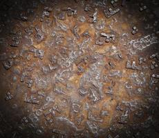 Detail of the rusty pattern from a manhole cover photo