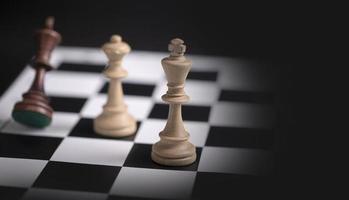 Chess pieces on a chessboard. The concept of playing and winning a chess tournament photo