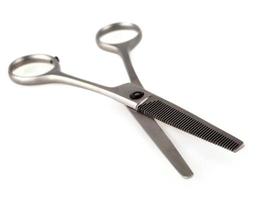 Professional Metal Haircutting Scissors isolated on white background. Selective focus photo