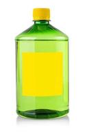 plastic transparent bottle with green chemical liquid with label on white photo