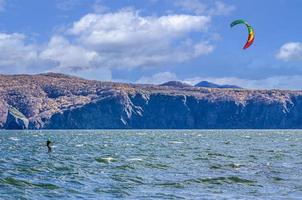 Kitesurfing on the waves in the Pacific Ocean off the coast of the Kamchatka Peninsula