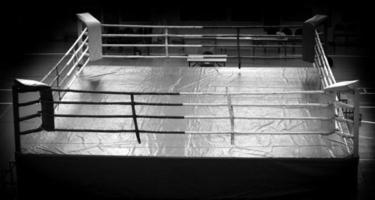 modern Professional boxing ring illuminated in the middle photo