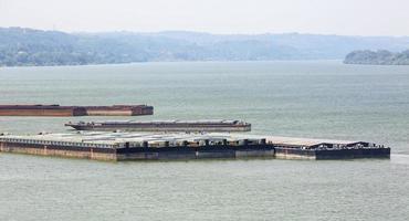 barge transports cargo on the river. Selective focus photo