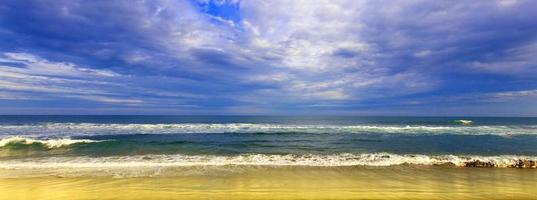 perfect sky, yellow beach and water of ocean photo