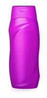 pink plastic bottle with shampoo carved on a white background photo