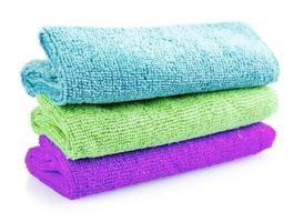 Stack of color microfiber cloths isolated on white background photo