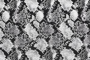 Black and white abstract camouflage. The concealment pattern on a fabric. photo