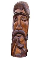 wooden idol statue of koryak on a white background. Selective focus photo