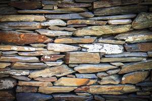 stone fence of solid pieces of stone. Close up photo