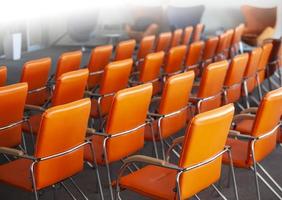 red chairs in ordinary empty waiting room. Selective focus photo