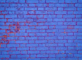 blue brick wall with red lighting. Texture grunge brick photo