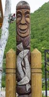 wooden idol statue of koryak on Kamchatka peninsula photo