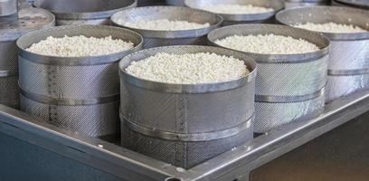 Making delicious cheese at a cheese factory. Selective focus photo