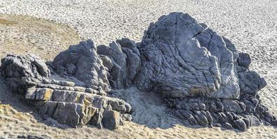 Big surfer waves and rocks at beach Puerto Escondido Mexico. photo