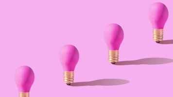 Pink lamp on pink background. Creative idea or startup concept. Monochrome footage. High quality 4k footage video