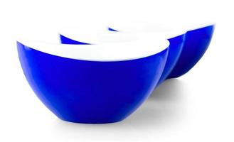 three blue plates isolated on white background photo