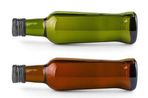 set of lying on the side bottle with olive oil on white photo