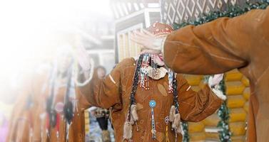 Folk ensemble performance in dress of indigenous people of Kamchatka. Selective focus photo