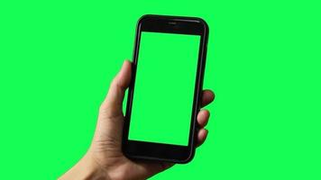 Green screen, smartphone green screen in hand, hand holding green screen smart phone video