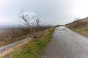 road in the countryside on a top of the hill photo