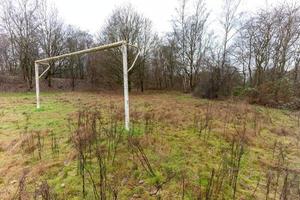 a desolate football  field in the morning photo