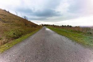 road in the countryside on a top of the hill photo