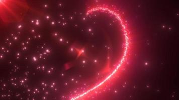 Abstract glowing festive heart love red from the lines of magical energy from particles on a dark background for Valentine's Day. Abstract background. Video in high quality 4k, motion design
