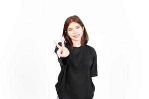 Showing Peace Sign and Smile Of Beautiful Asian Woman Isolated On White Background photo