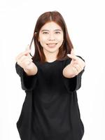 Showing Korean love finger Of Beautiful Asian Woman Isolated On White Background photo