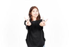 Showing Peace Sign and Smile Of Beautiful Asian Woman Isolated On White Background photo