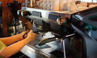 Close-up of banner size of barista working makeing coffee with coffee machine photo