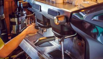 Close-up of banner size of barista working makeing coffee with coffee machine photo