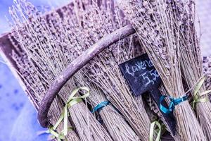 Lavender in a basket, lavender on the counter street. Bunch bouquet of fresh lavender in a wooden chair. photo