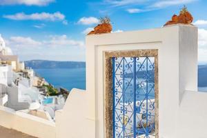 White architecture in Santorini island, Greece. Traditional village and building with sea view and Santorini cyclades scenery. Relaxing summer vacation concept photo