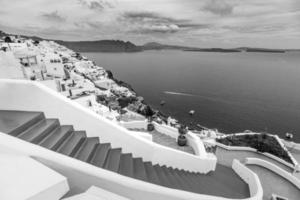 Santorini Greece process in dramatic black and white. Beautiful artistic image of Santorini white architecture as beautiful travel landscape. photo