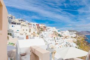 White architecture on Santorini island, Greece. Beautiful summer landscape, sea view. Oia village, amazing scenery and vacation mood, wonderful holiday concept. Idyllic travel background photo