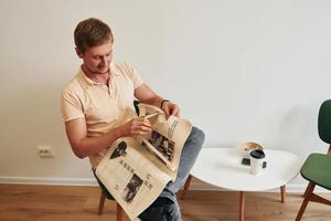 Man reading a newspaper photo