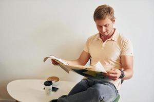 Man reading a newspaper photo