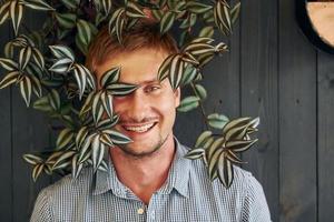 Handsome man with plants photo