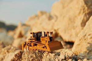 Loading vehicle miniatures outdoors on the borrow pit at daytime photo