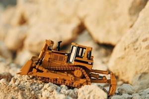 Loading vehicle miniatures outdoors on the borrow pit at daytime photo