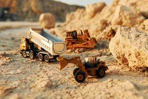 Loading vehicle miniatures outdoors on the borrow pit at daytime photo