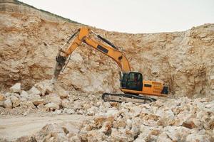 Loading vehicle is outdoors on the borrow pit at daytime photo