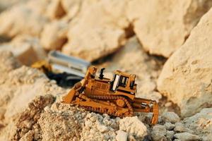 Loading vehicle miniatures outdoors on the borrow pit at daytime photo