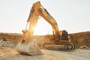 Loading vehicle is outdoors on the borrow pit at daytime photo