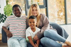 Mixed race family together photo