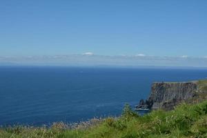 Moher cliffs and atlantic ocean in Ireland photo