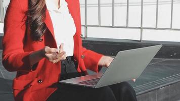 Mature businessman using a digital tablet to discuss information with a younger colleague in a modern business lounge video